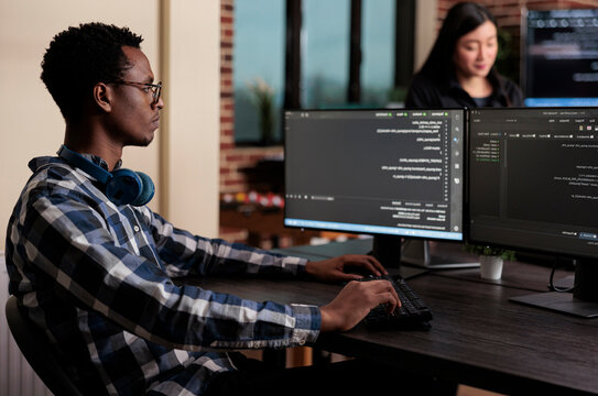 Cyber security company employee developing blockchain based database processing system presents data protection, software systems and secure infrastructure in a technology workspace.
