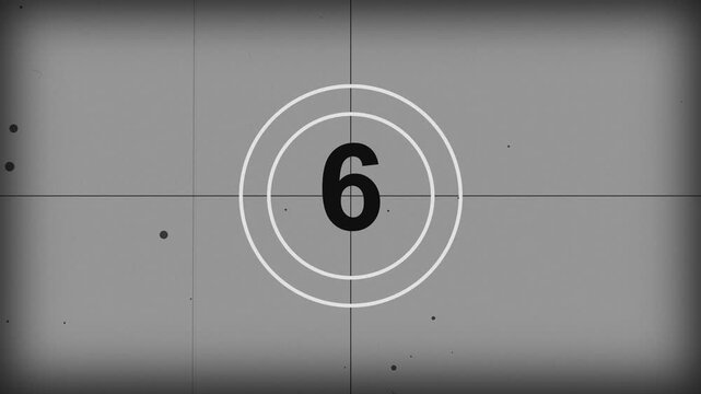 Retro film leader countdown, worn analog projector clock with dust and scratches