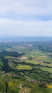  Green Countryside Near Rome From Above.Scenic aerial video showing wide open farmland near Rome. Captures patterns in the crops, dirt paths with a calm, natural vibe.