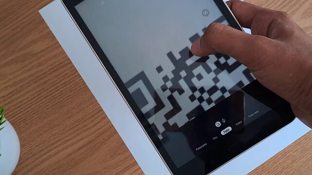 Asian hand scanning QR code with tablet on wooden desk. Digital payment, technology, business. 4K video for qr code, tablet, scan, technology, digital, payment, business, asian, hand, mobile, device, 