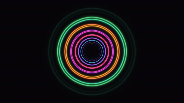 Colorful glowing circles form a tunnel effect on a dark background