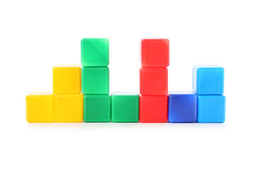 Naklejka premium Colorful plastic building blocks arranged in a bar graph shape, data visualization and growth concepts, isolated on a white background