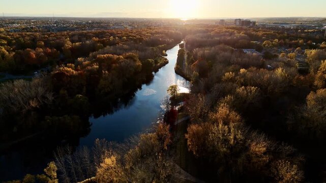 Aerial sunset view of Angrignon Park and Lachine Canal in Montreal, Quebec, Canada during autumn. g.