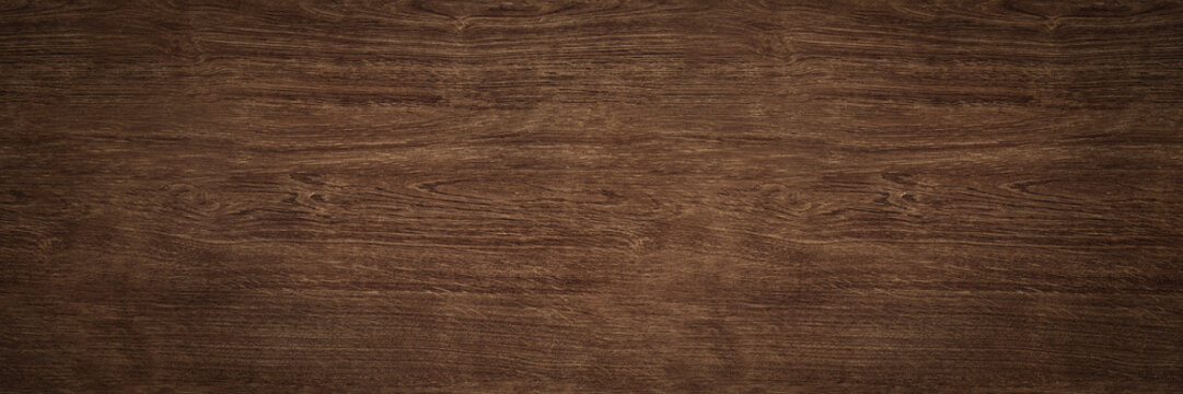 Dark wood background texture. Rustic old wooden brown surface with wood grain detail.
