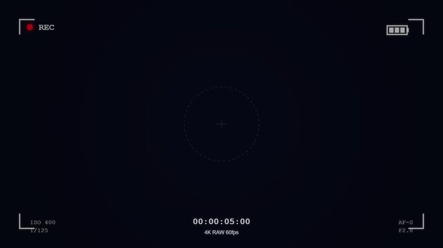 Digital camera recording interface overlay with time code and focus reticle, dark background