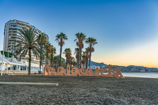 Malagueta beach sign at sunrise in Malaga