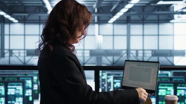 System administrators work in a server room with laptop as server virtualization, coffee workflow and infrastructure reliability shape the infrastructure task.