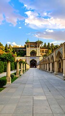 Obraz premium Long Pathway Leading to Ornate Arched Gate in Historical Courtyard Setting