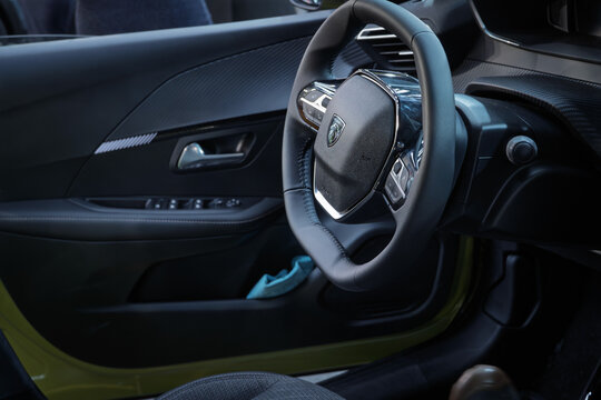 BELGRADE, SERBIA - MARCH 22, 2026: Interior of a Peugeot steering wheel with the lion emblem in belgrade. Peugeot is a French car and automotive manufacturer, spread worldwide, part of stellantis.