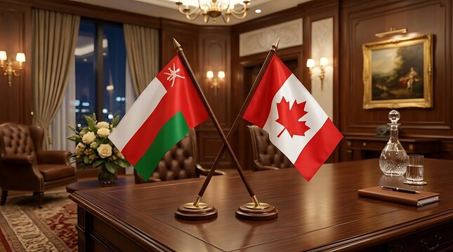 National Flags of Oman and Canada on an Elegant Wooden Desk Representing Diplomatic Relations