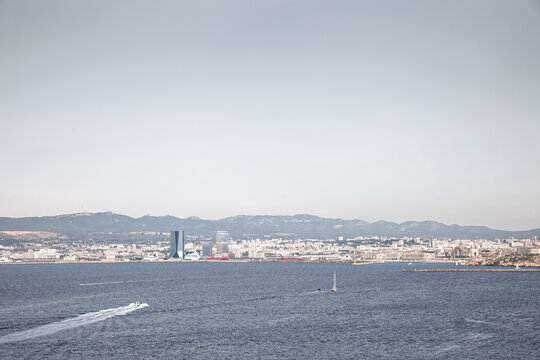 Panoramic view of the Grand Port Maritime de Marseille, Port de Marseille Fos, in France, with harbor waters, shipping activity, a symbol of french trade and mediterranean commerce.