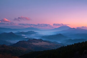 Obraz premium Purple sunset clouds illuminating layered mountain ridges and valleys at twilight with mountain landscape twilight wilderness majestic elevation topography beautiful exploration panoramic