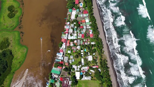 Tortuguero town aerial view between ocean and river