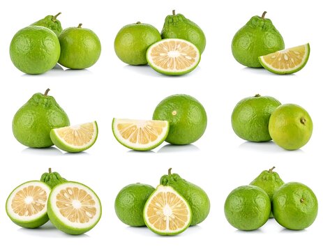Fresh green apples with slices on white background.