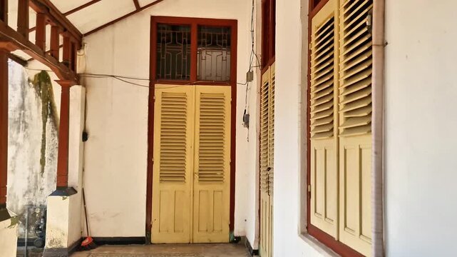 Madoun, Indonesia - 8 July, 2026: Historic Colonial-Era Landmark: A Well-Preserved 1912 Dutch Building in Tropical Indonesia