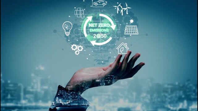 Conceptual hand holding futuristic icons representing sustainable energy sources, climate action, and net zero emissions for 2050 goal in urban backdrop. Entropy.