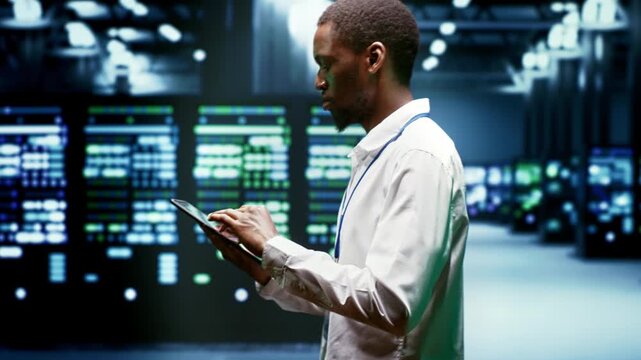 African American system administrator maintains cryptocurrency mining hardware in a supercomputer farm, supporting blockchain processing during checkup blockchain supercomputer farm.