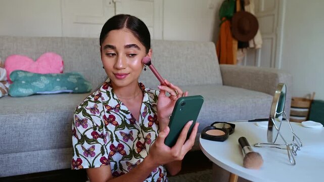 Influencer creating content with makeup tutorial at home