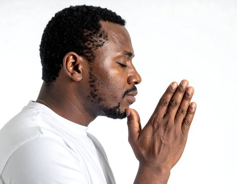 Man with beard touching his ear thoughtfully.