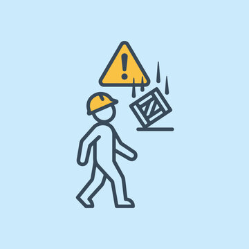 A construction worker faces falling objects