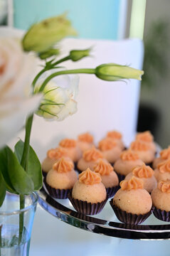 gourmet brigadeiro sweets with dulce de leche piping, elegant wedding candy presentation on glass stand, luxury dessert catering event buffet, delicious confectionery close up