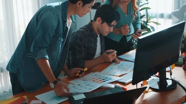 Top view of project manager looking at screen while designer writing idea. Close up of smart business team explain idea of logo design while designer choose theme while looking at palette. Symposium.
