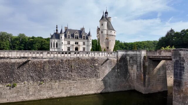 Scenic view of the moat and towers of Ch&acirc;teau de Chenonceau on a bright June day in the French countryside