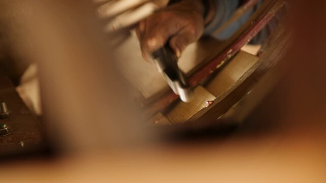 Peening copper nail on rove fastening ribs to clinker boat hull
