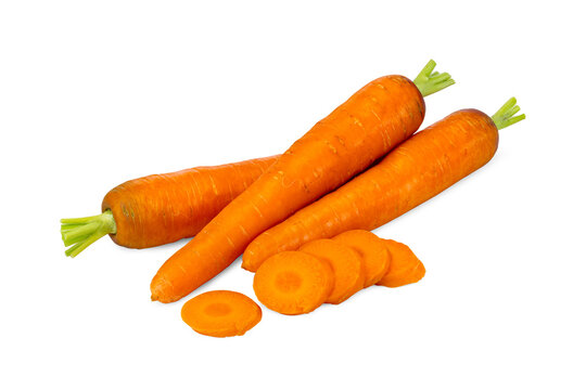 Whole Carrots with Green Stems and Round Slices on White Background
