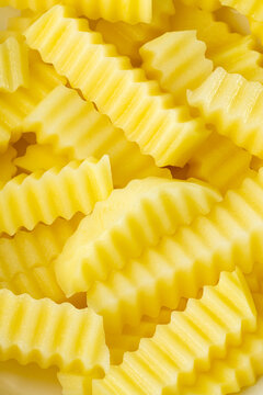 Close-up of Raw Wavy Potato Strips Top View
