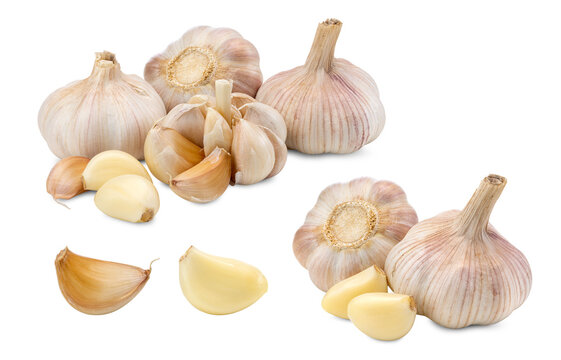 Close-up of Whole Garlic Bulbs and Peeled Cloves on White Background
