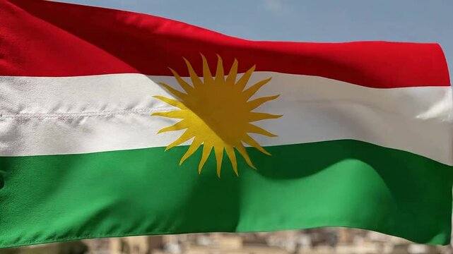 Kurdish Flag Flapping in Wind with Clear Sky
