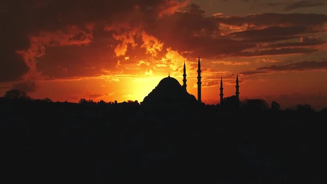 Suleymaniye Mosque silhouette at sunset in Istanbul