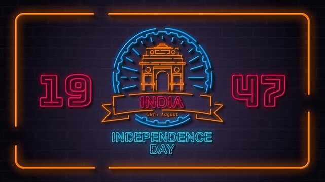 4K India Independence Day loop video in neon sign style with a glowing India Gate emblem, Ashoka Chakra wheel, and 1947 text on a brick wall for event screens and digital ads.