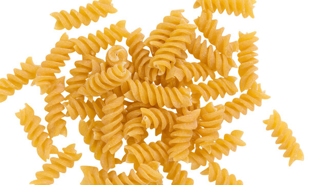Pile of golden fusilli pasta spirals, isolated on transparent background