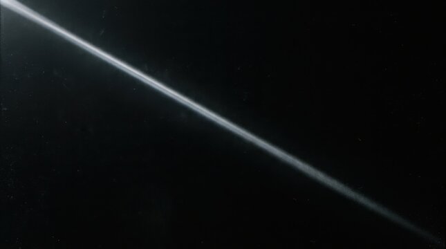 Diagonal Light Beam Streak Across Dark Abstract Background