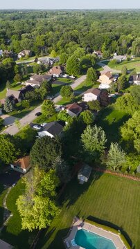 Vertical Drone Shot of a Picturesque Suburban Residential Neighborhood