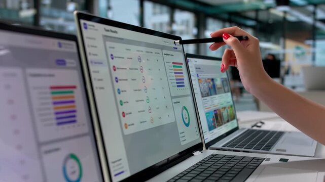 Corporate Training Manager Reviews Employee Progress