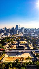 Obraz premium Aerial View of Urban Cityscape with Skyscrapers and Parks During Daytime