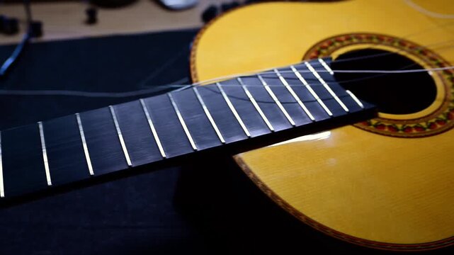Close up of a classical guitar changing strings