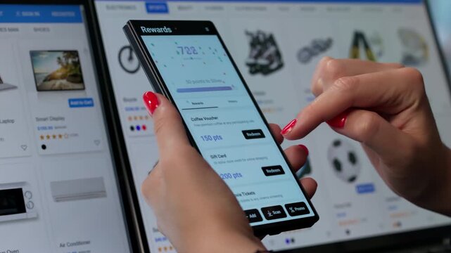 Young Woman Using Phone App To Earn Points