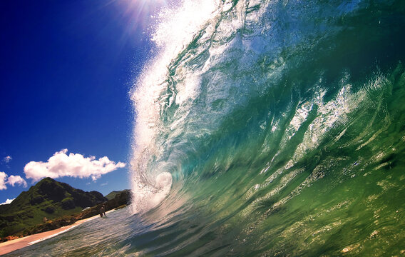 Majestic Turquoise Wave Curling Perfectly Against Blue Sky