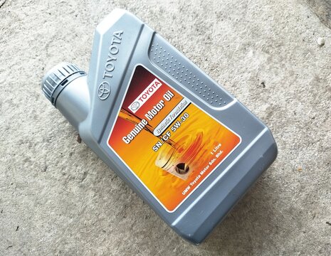 KUALA TERENGGANU MALAYSIA- JULY 10.2026: Close-up of a Toyota synthetic formulation engine oil container distributed by UMW Toyota Motor Sdn. Bhd., showcasing automotive product packaging.