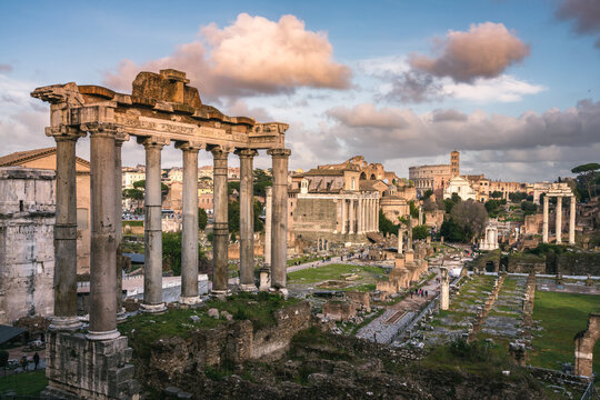 The Roman Forum at sunset with the Colosseum beyond, Rome, Italy