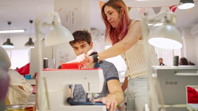 Fashion design instructor teaching sewing machine techniques