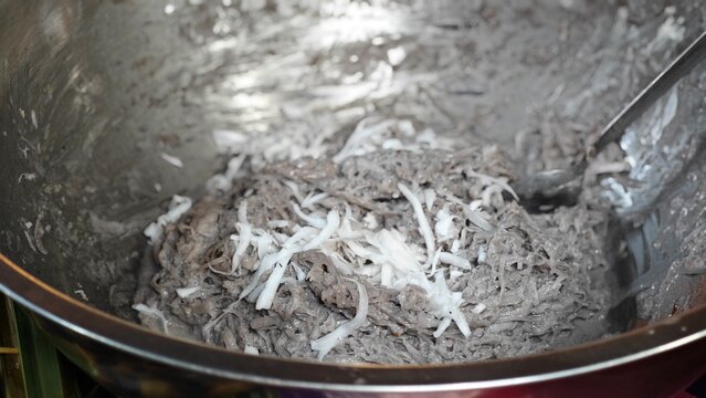 Nipa palm dessert. Sticky rice flour, palm sugar and shredded coconut meat.