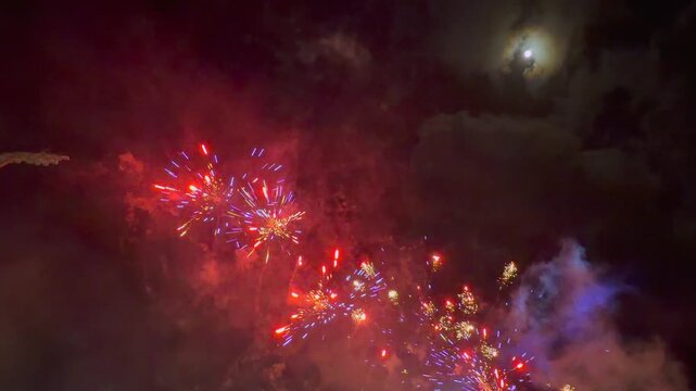 Spectacular fireworks and laser light show illuminating the night sky in Mahe during the 50th Independence Day anniversary celebration of Seychelles.