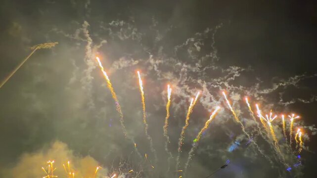 Spectacular fireworks and laser light show illuminating the night sky in Mahe during the 50th Independence Day anniversary celebration of Seychelles.