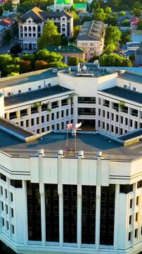 Vertical video. Simferopol, Crimea. State Council of the Republic of Crimea. City center panorama at sunset time. Drone footage. Rich colors