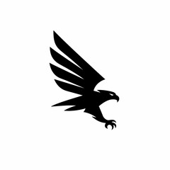 Naklejka premium Black silhouette of a falcon bird with wings spread wide.